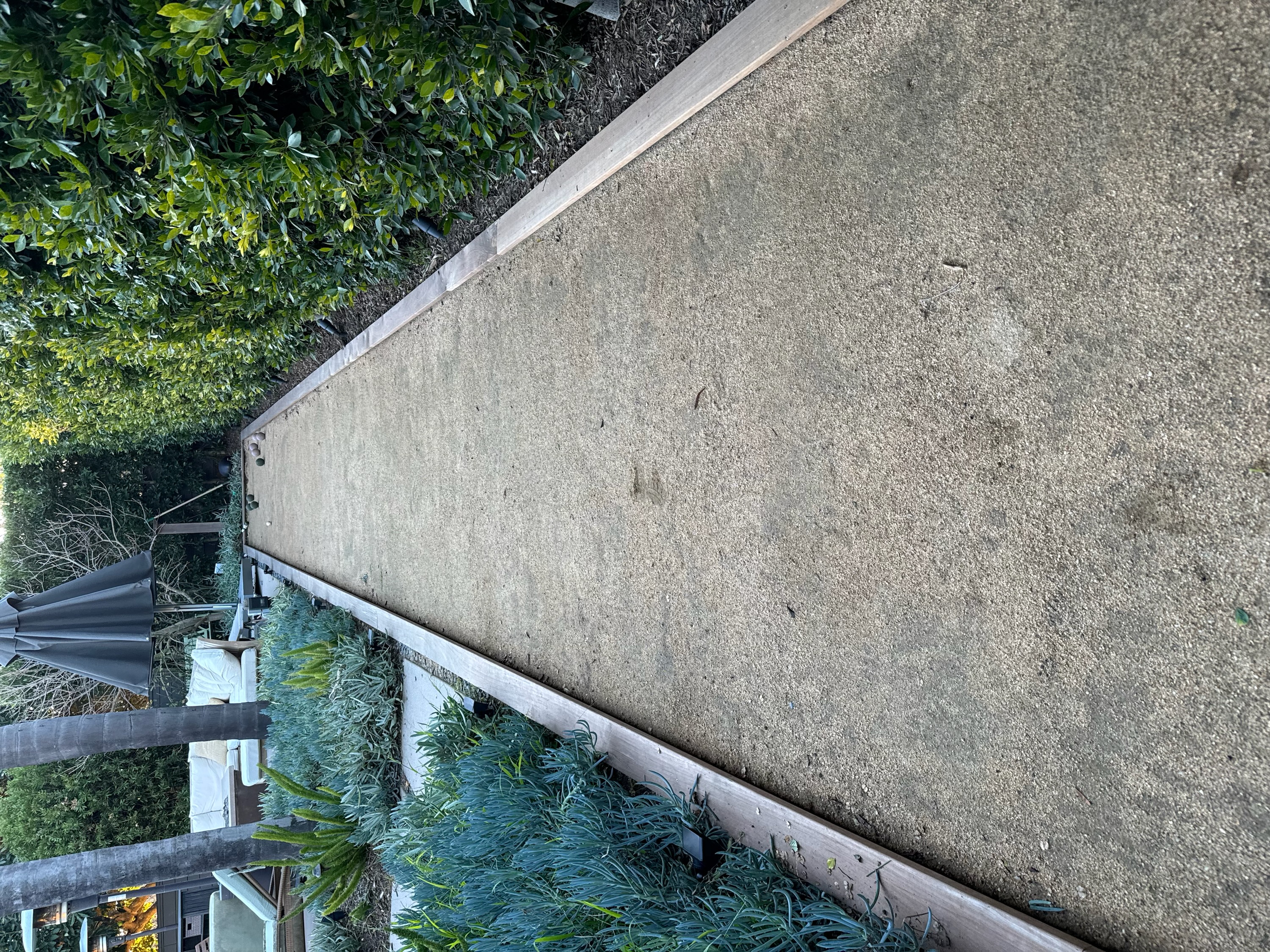 Custom bocce ball court as a backyard recreation destination in Santa Barbara.