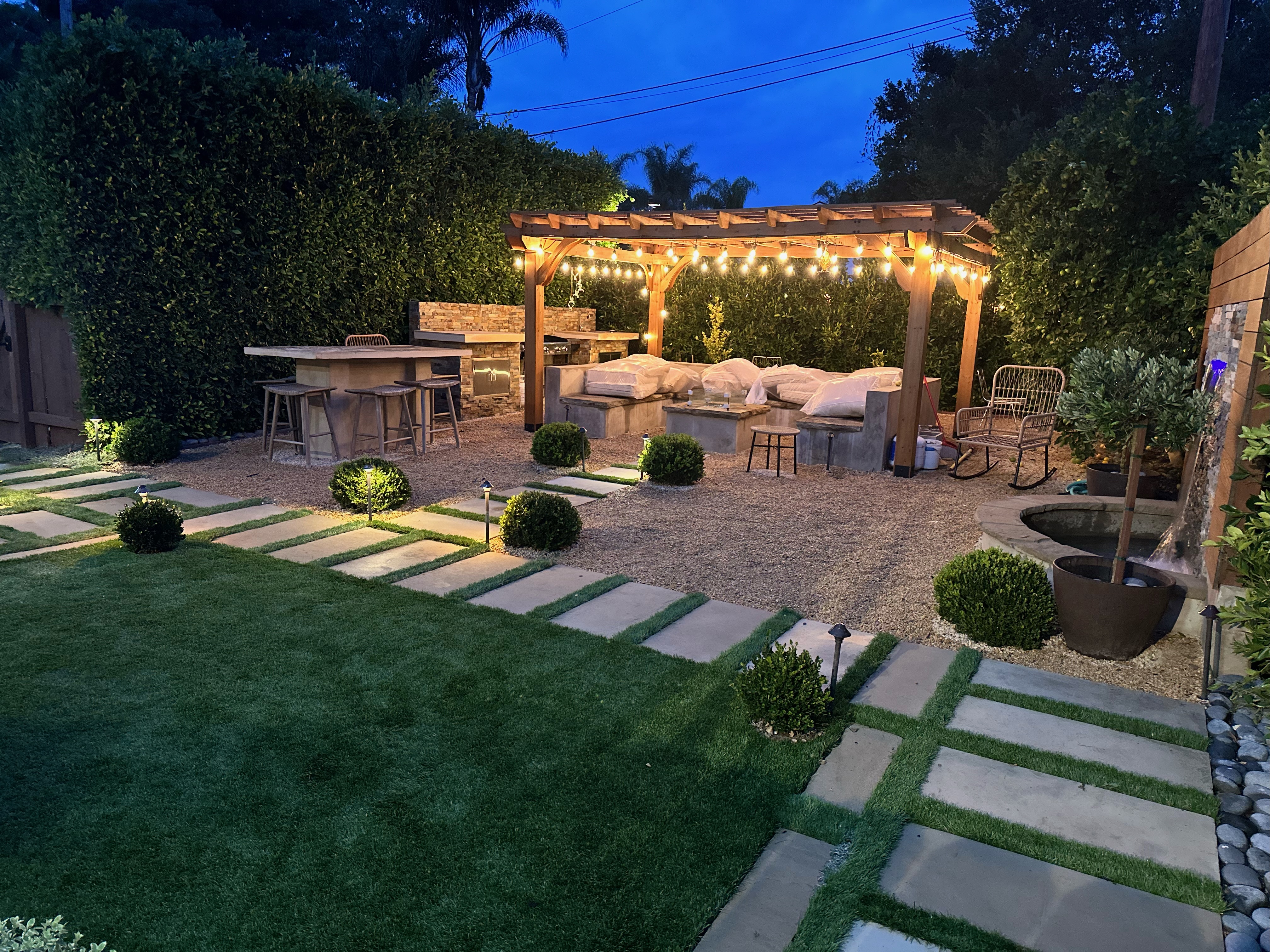 Complete outdoor entertaining destination with pergola, kitchen, and fire feature in Santa Barbara.
